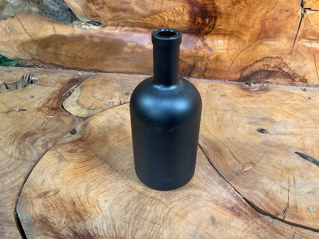 Sunflower in Black Bottle