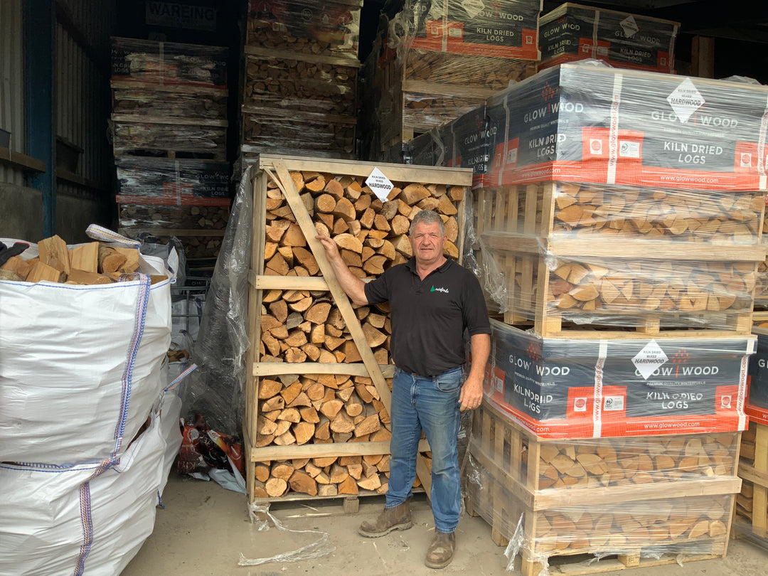 Kiln dried hardwood in large hand stacked pallets